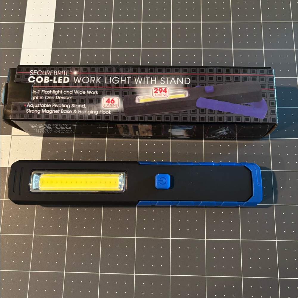 SecureBrite COB LED Work Light with Stand. Is blue